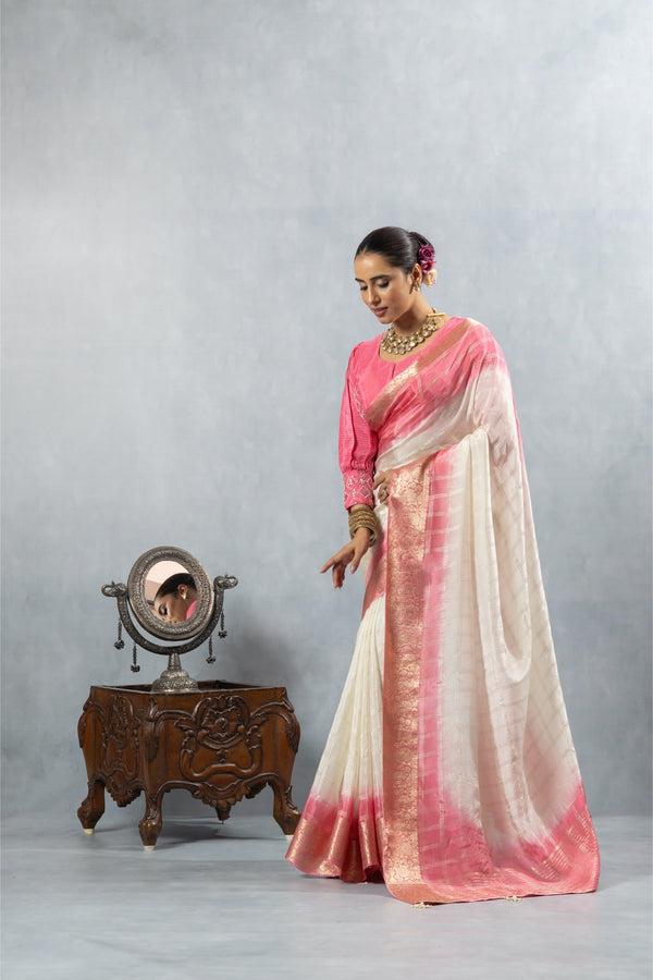An elegant pose of the model in the Vanya Sarees ombre tissue silk saree, showcasing the full designer ensemble by a vintage mirror.