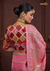 The stunning back view of the Vanya Sarees designer blouse, showcasing the rich multi-color Patola-style print.