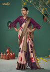 An elegant standing pose of the model showcasing the complete designer look of the Vanya Sarees color block Patola weave saree.
