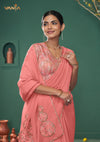 A beautiful close-up of the model in a Vanya Sarees saree, highlighting the rich, multi-color floral embroidery on the border and printed blouse.