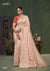 A full-length view of the model in Vanya Sarees' elegant peach pink Katan Banarasi silk saree with gold zari buttis.