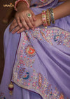 A detailed close-up of the pallu of the Vanya Sarees saree, showing the intricate multi-color peacock embroidery with sequin and zari work.