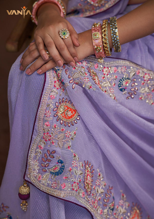 A detailed close-up of the pallu of the Vanya Sarees saree, showing the intricate multi-color peacock embroidery with sequin and zari work.