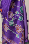 A close-up showing the artistic lotus flower print on the Vanya Sarees purple Tussar silk Pichwai saree.