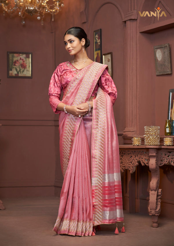 An graceful standing pose of the model showcasing the complete designer look of the Vanya Sarees pink Tussar silk saree.