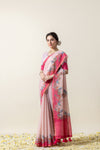 Model in a graceful pose in the Vanya Sarees pink printed linen cotton saree, perfect for a festive or day wedding look.
