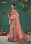 A full-length view of the model in Vanya Sarees' magnificent pink ombre silk saree with a heavy, multi-color embroidered border.
