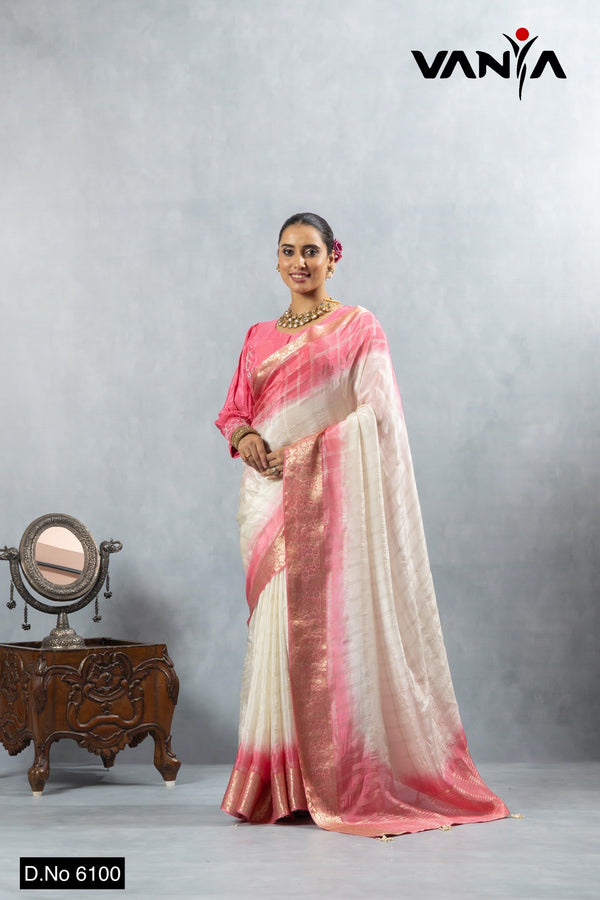 A full-length view of the model in Vanya Sarees' romantic ivory and pink ombre tissue silk saree with a designer blouse.