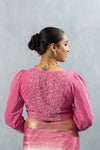 The heavily embellished back of the pink designer blouse from Vanya Sarees, showcasing the intricate sequin work in a diamond pattern.