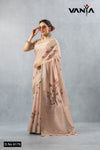 A full-length view of the model in Vanya Sarees' chic blush pink striped linen saree with an artistic bird print.
