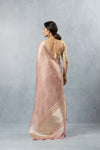 A full back view of the model in the Vanya Sarees ensemble, displaying the drape of the tissue silk pallu and the deep back of the embroidered blouse.