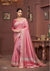 A full-length view of the model in Vanya Sarees' elegant rose pink Tussar silk saree with a contemporary chevron border.