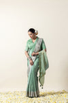 Model in a graceful pose in the Vanya Sarees pista green Chanderi silk saree, perfect for a reception or cocktail event.