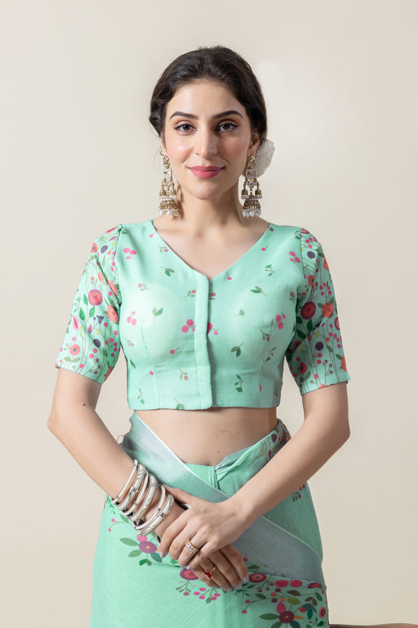 A clear front view of the Vanya Sarees readymade designer blouse in mint green, showing the V-neck and puff sleeves.