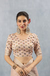 A clear front view of the Vanya Sarees readymade designer blouse, showing the all-over floral butti print on striped linen fabric.