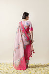 A full back view of the model in the Vanya Sarees ensemble, displaying the beautiful bird and floral print on the pallu and blouse.