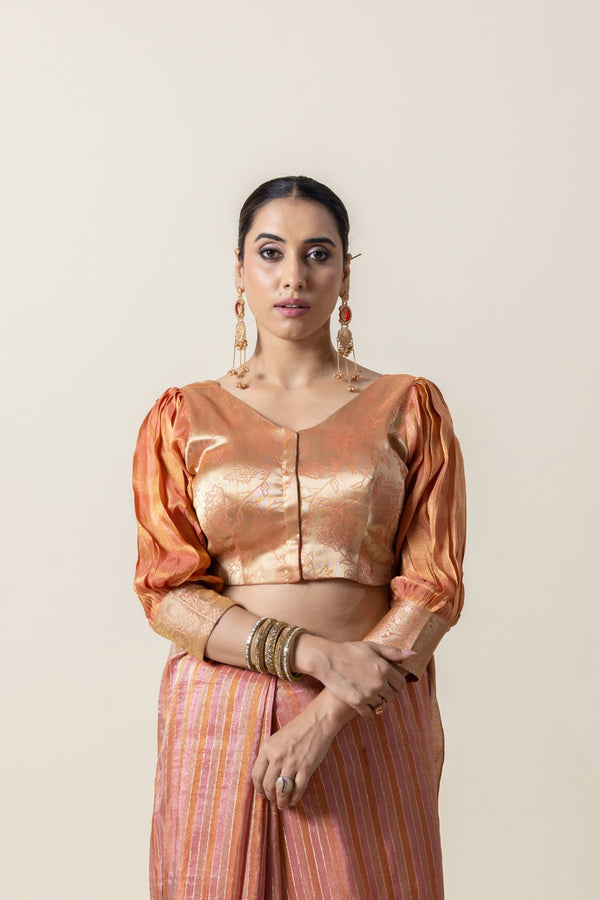 A clear front view of the readymade designer blouse from Vanya Sarees, highlighting the voluminous puff sleeves and brocade fabric.
