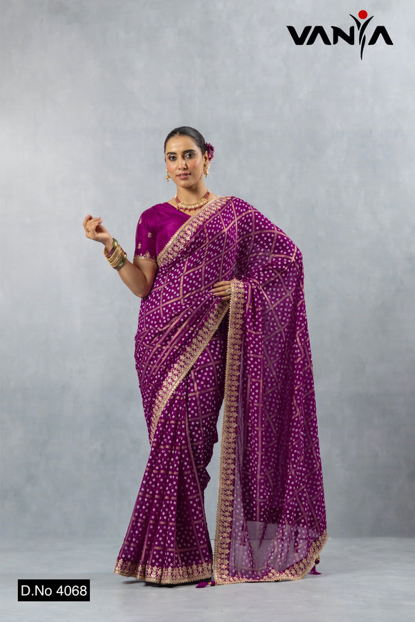 A full-length view of the model in Vanya Sarees' regal magenta purple Bandhani georgette saree with a heavy embroidered border.