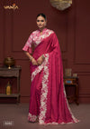 A full-length view of the model in Vanya Sarees' magnificent rani pink saree with a heavy, ivory embroidered cutwork border.