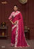 A full-length view of the model in Vanya Sarees' magnificent rani pink saree with a heavy, ivory embroidered cutwork border.