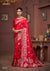 A full-length view of the model in Vanya Sarees' magnificent red and gold bridal Katan Banarasi silk saree.