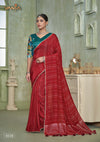A full-length view of the model in Vanya Sarees' elegant red crushed georgette saree with a contrasting teal Kalamkari print blouse.