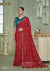 A full-length view of the model in Vanya Sarees' elegant red crushed georgette saree with a contrasting teal Kalamkari print blouse.