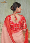 The stylish designer back of the red Gharchola print blouse from Vanya Sarees, featuring a dori tie-up and tassel.