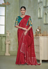 An graceful standing pose of the model showcasing the complete designer look of the Vanya Sarees red saree and artistic teal blouse.