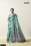 A full-length view of the model in Vanya Sarees' artistic sage green Tussar silk saree with a Madhubani-style print.