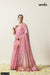 Official catalogue image for Vanya Sarees (D.No 6149) showing a model in a rose pink Leheriya saree with a white designer blouse.