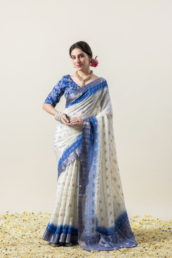 A full-length pose of the model showcasing the complete elegant look of the Vanya Sarees white and blue tie-dye Chanderi saree.