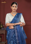 A beautiful close-up of the model in a Vanya Sarees saree, highlighting the intricate mirror work on the white designer blouse.