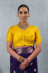 A clear front view of the Vanya Sarees readymade designer blouse in yellow, showing the V-neck and delicate sleeve embroidery.