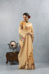 A joyful, smiling pose of the model in the Vanya Sarees golden yellow embroidered saree, perfect for a festive occasion.