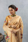 A close-up of the model in a Vanya Sarees yellow Chanderi silk saree, showing the detailed embroidery and the designer blouse.