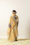 Full back view of the model wearing the Vanya Sarees Pichwai printed saree, showing the drape of the pallu and the designer blouse.