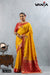 A full-length view of the model in Vanya Sarees' auspicious yellow and red Katan Banarasi silk saree.