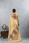 A full back view of the model in the Vanya Sarees ensemble, displaying the bird embroidery on the pallu and the statement blouse.