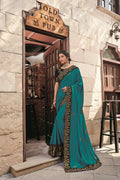 Zari Embroidered Firozi And Turquois Blue Satin Saree With More Peach Velvet Blouse Designer Saree