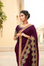 Wine coloured machine embroided satin jacquard saree with a matching wine coloured raw silk blouse